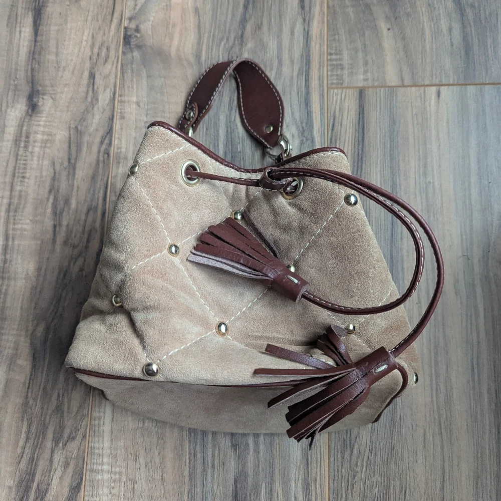 Claudia Firenze Leather Bucket Bag With Pull Top And Tassels.